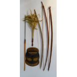 A tribal mask, 51cm H, 30cm W., fly swat, three bows and a spear, (6)