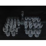 A Waterford Crystal part suite of cut glass tableware decorated in the Lismore pattern, comprising