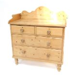 A Victorian pine chest, with shaped splash back and scroll sides to the top, with two short and
