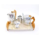 A Picquot ware five piece tea set, comprising twin handled tray, tea pot, hot water jug, cream