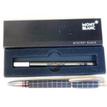 A Montblanc resin fine liner pen, in lattice colours on black ground with chrome finish clip and