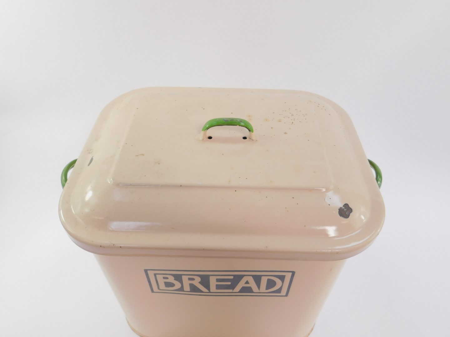 A mid 20thC enamel twin handled bread bin and cover, cream with green handles, 31cmH, 40cm W, 25cm - Image 2 of 4