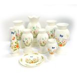 Five Aynsley porcelain vases decorated in the Wild Tudor pattern, of molded baluster form,