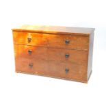 A scumbled pine chest of drawers, with two short over two long drawers, raised on block feet,
