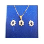 A 9ct gold and sapphire pendant on chain, together with matching earrings, 2.7g.