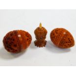 Two Victorian Coquilla nut holders, of carved ovoid form, 5cm H and 5.5cm H respectively, together