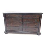 A Chinese Victorian style dark oak dresser, with eight drawers flanked by demi pilasters, raised