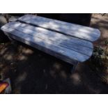 A pair of stained pine garden benches, 152cm W, 31cm D.