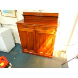 A Victorian mahogany chiffonier, with a shelf back over two drawers above panelled cupboard doors,