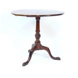 A George III mahogany tilt top occasional table, the circular top raised on a turned and spiral