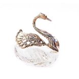 A cut glass butter dish of swan form, with white metal neck and head, and hinged kissed wings