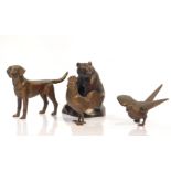 A bronze figure of a Labrador modelled in standing pose, 15cm W, together with a cockerel, 10cm H,