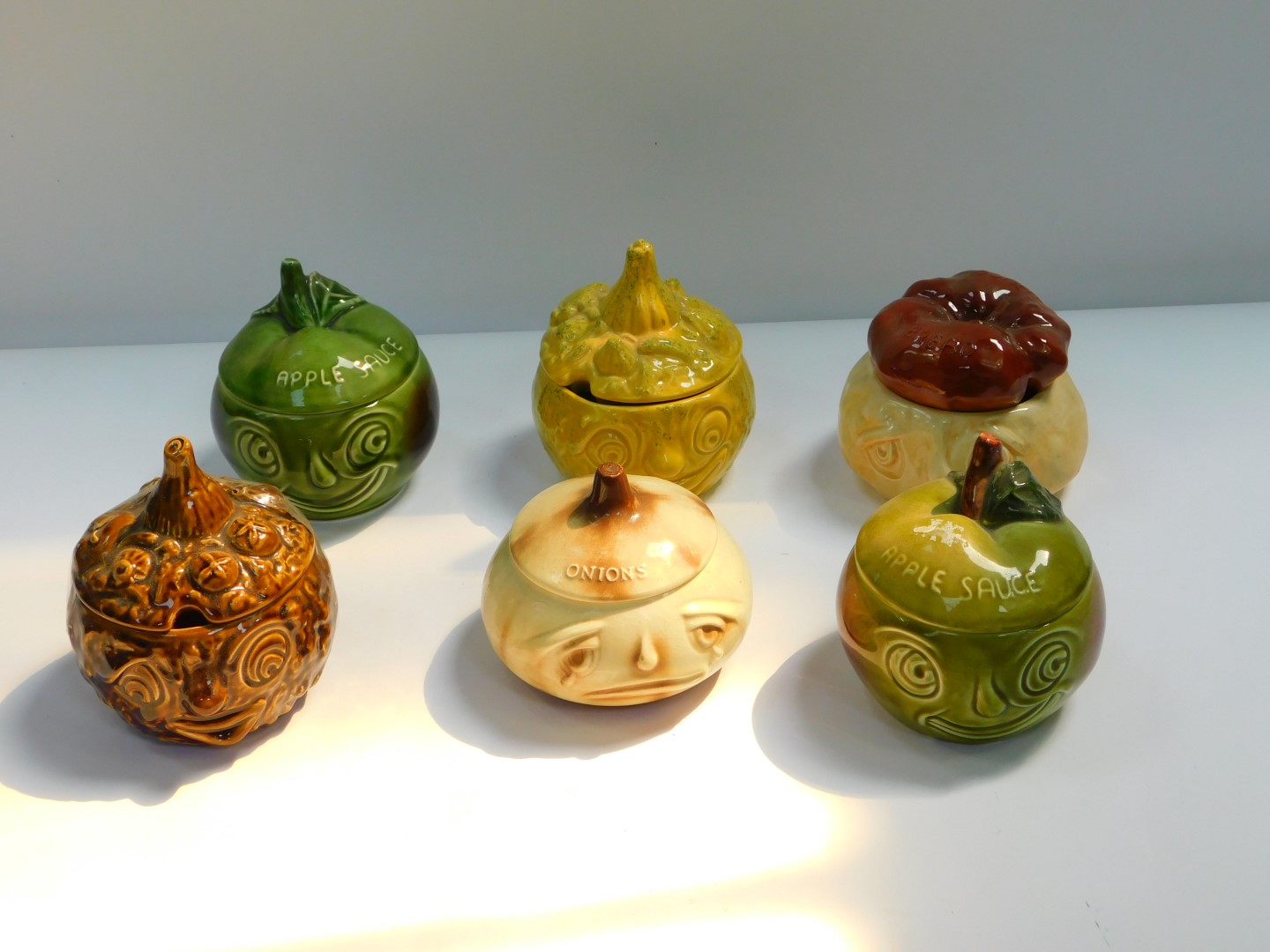 Six Sylvac pottery character pots, comprising chutney, bread sauce, piccalilli, onions and two apple