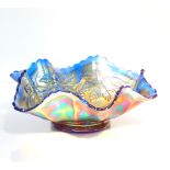 A Carnival blue glass dish, of six sided form moulded with vines, 18cm w