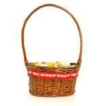 A basket containing onyx and marble eggs. (qty)