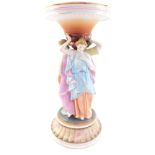 A Continental porcelain Three Graces figural table centrepiece stand, decorated in multi coloured