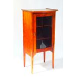 An Edwardian mahogany bow fronted display cabinet, by A Wilson, Peck & Company Ltd., Sheffield,