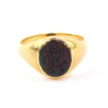 A gentleman's blood stone signet ring, monogram engraved, in yellow metal, stamped 18ct, size R, 6.