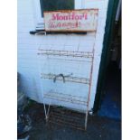A mid 20thC cast iron shop display stand, for Montfort Underwear, with three tiers and an under