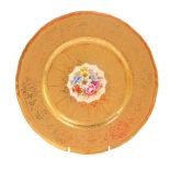 A Royal Worcester porcelain cabinet plate, circa 1958, painted by Freeman, with flowers, within a