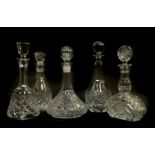 Five English and Continental cut and pressed glass decanters and stoppers, including a mallet shaped