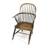 A 19thC oak and elm Windsor chair, with solid saddle seat, raised on turned legs united by an H