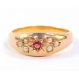 A ruby and seed pearl ring, set in yellow metal, size T, 6.9g.