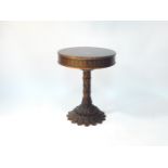 An Adam style wooden and plaster drum table, the circular top printed with classical paterae and