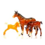 A Beswick model of a standing brown gloss horse, together with a Beswick foal, 8cm H, and a