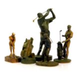 Five bronzed plaster golfing sculptures, comprising a golfer taking a swing, 33cm H, golfer with