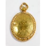 A Victorian pinchbeck photo locket, of oval form, floral and foliate engraved, with shield reserve