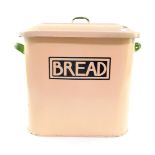 A mid 20thC enamel twin handled bread bin and cover, cream with green handles, 31cmH, 40cm W, 25cm
