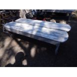 A pair of stained pine garden benches, 152cm W, 31cm D.