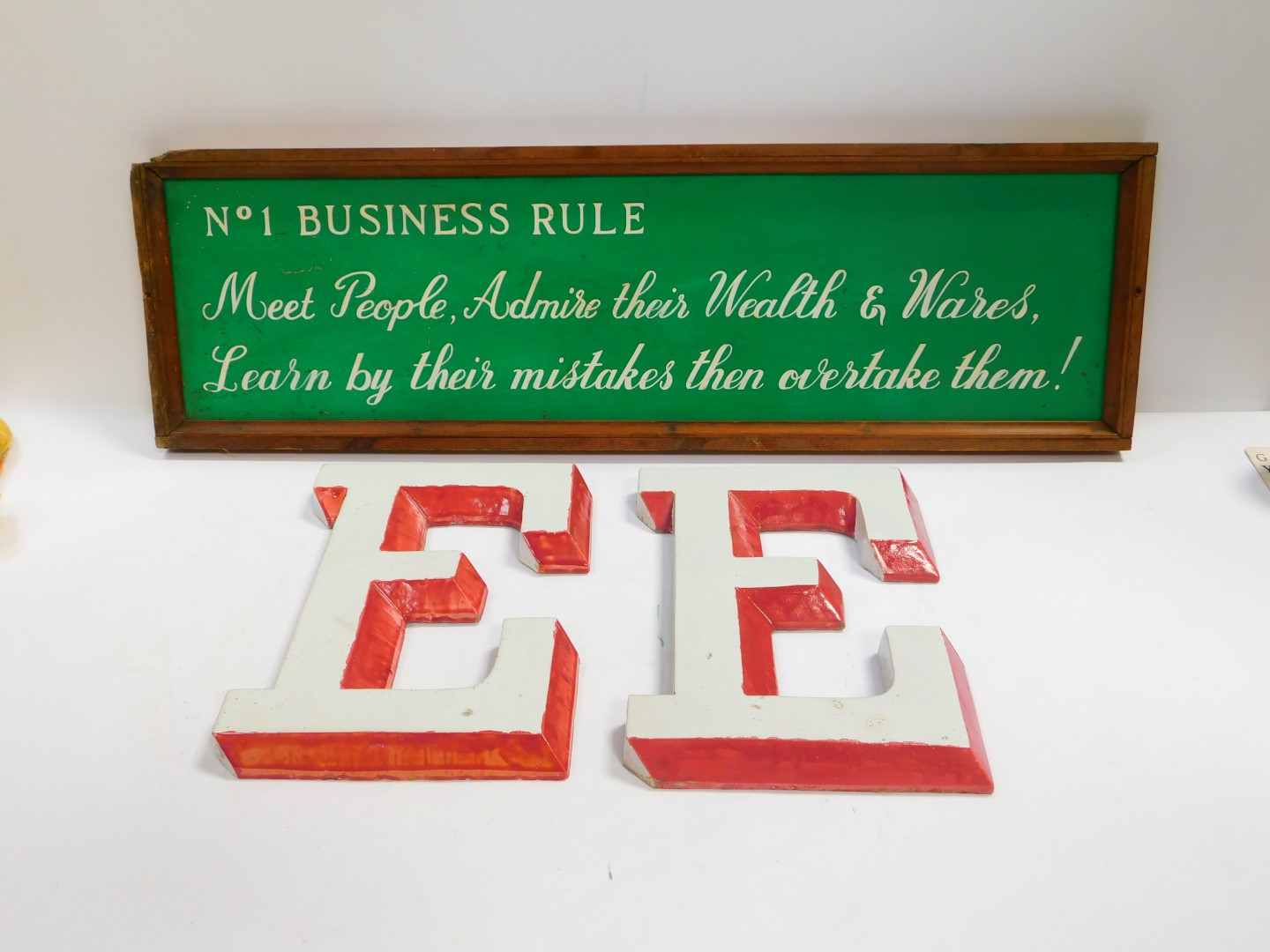 A pair of pottery E wall plaques, 34cm x 24.5cm, together with a framed tin sign, painted with 'No 1