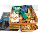 A Tabloid Tea tin, containing solitaire balls, solitaire board, jigsaw puzzle, cards, board game,