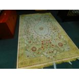 A Continental Aubusson style wall rug, decorated with a floral oval medallion in a surround of