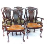 A set of eight George I style mahogany dining chairs, with floral and foliate carved vase shaped