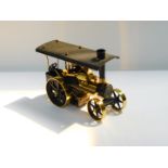 A Wilesco 'Old Smoky' black and brass steam traction engine, D366, 30cm W.