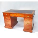 A Victorian mahogany twin pedestal desk, the rectangular top inset with tooled purple leather,
