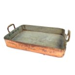 A French 19thC copper roasting tin, with twin brass handles, stamped Bain Ovonne, 68cm x 42.5cm.