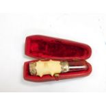 A Victorian meerschaum and amber cheroot holder, with silver mounts, foliate engraved, cased,