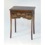 An Eastern hardwood side table, carved with panels of blossom, the front with three drawers, above a