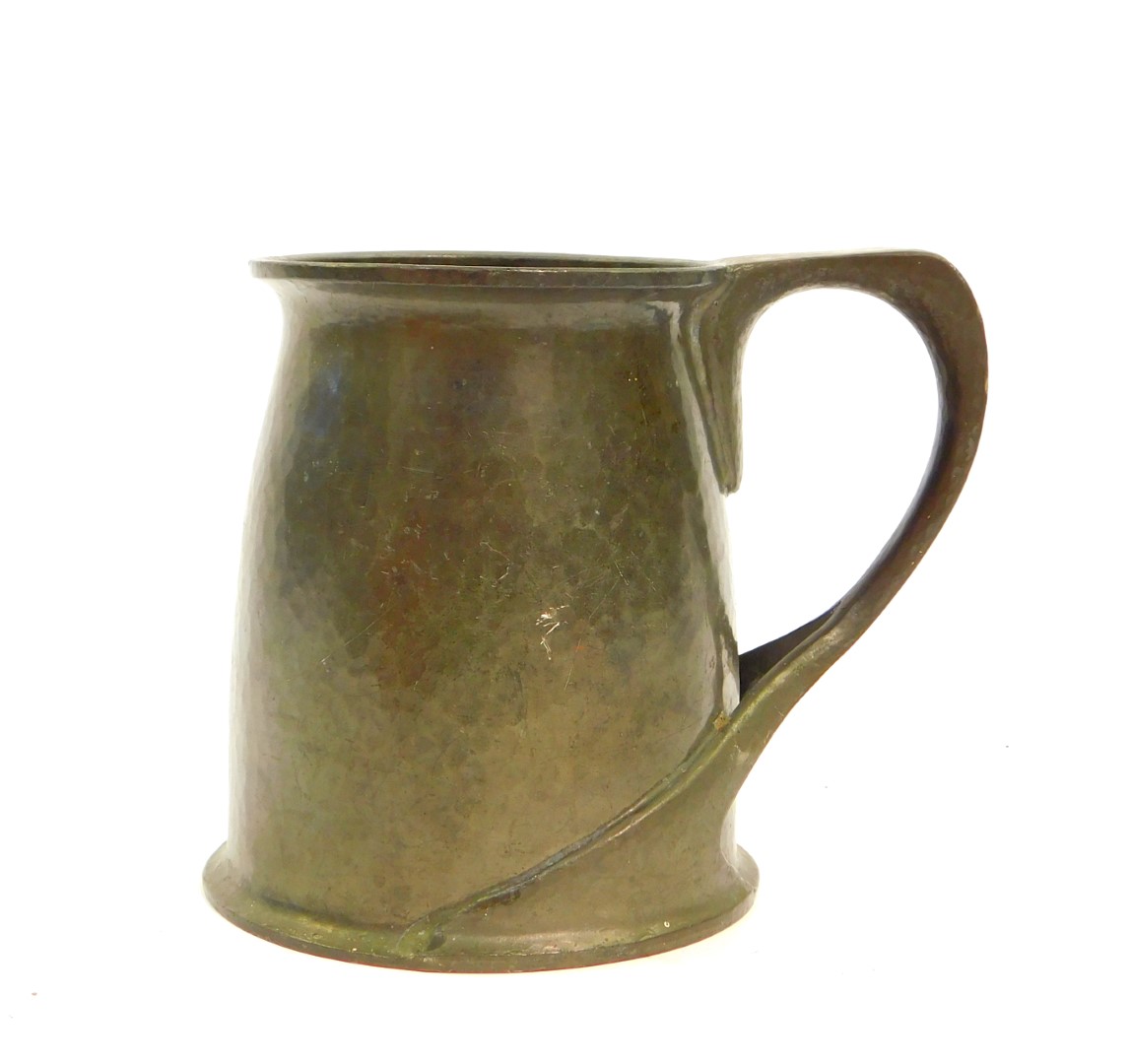 An Archibald Knox pewter tankard, no.066, possibly for Liberty and Co., with a hammered body and