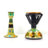 A Gouda Pottery candlestick, decorated in the Danier pattern, of four handled form, raised on a