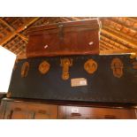 An early 20thC blue fabric cabin trunk, 31,5cm H, 92cm W, 51cm D, together with a faux wood tin