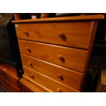 A pine chest of four long drawers, raised on turned feet, 80cm H, 79.5cm W, 43cm D.