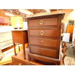 A mid 20thC oak sewing table, the hinged lid opening to reveal a lined interior above a frieze