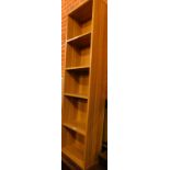 A narrow oak bookcase, of rectangular section, with four shelves, 173cm H, 40cm W, 29cm D.