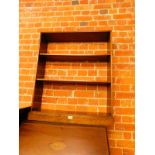 A mid 20thC oak open bookcase, of two shelves raised on a plinth base, 93cm H, 79cm W, 19.5cm D.