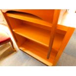 An light oak open bookcase, with two adjustable shelves, raised on square supports, 91cm H, 92cm